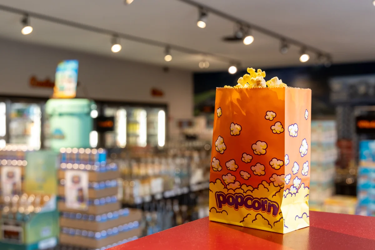 A carton of popcorn on the counter inside Brothers Liquor Store